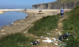 Trash on Tunitas Creek Beach (before cleanup and Improvement Project)